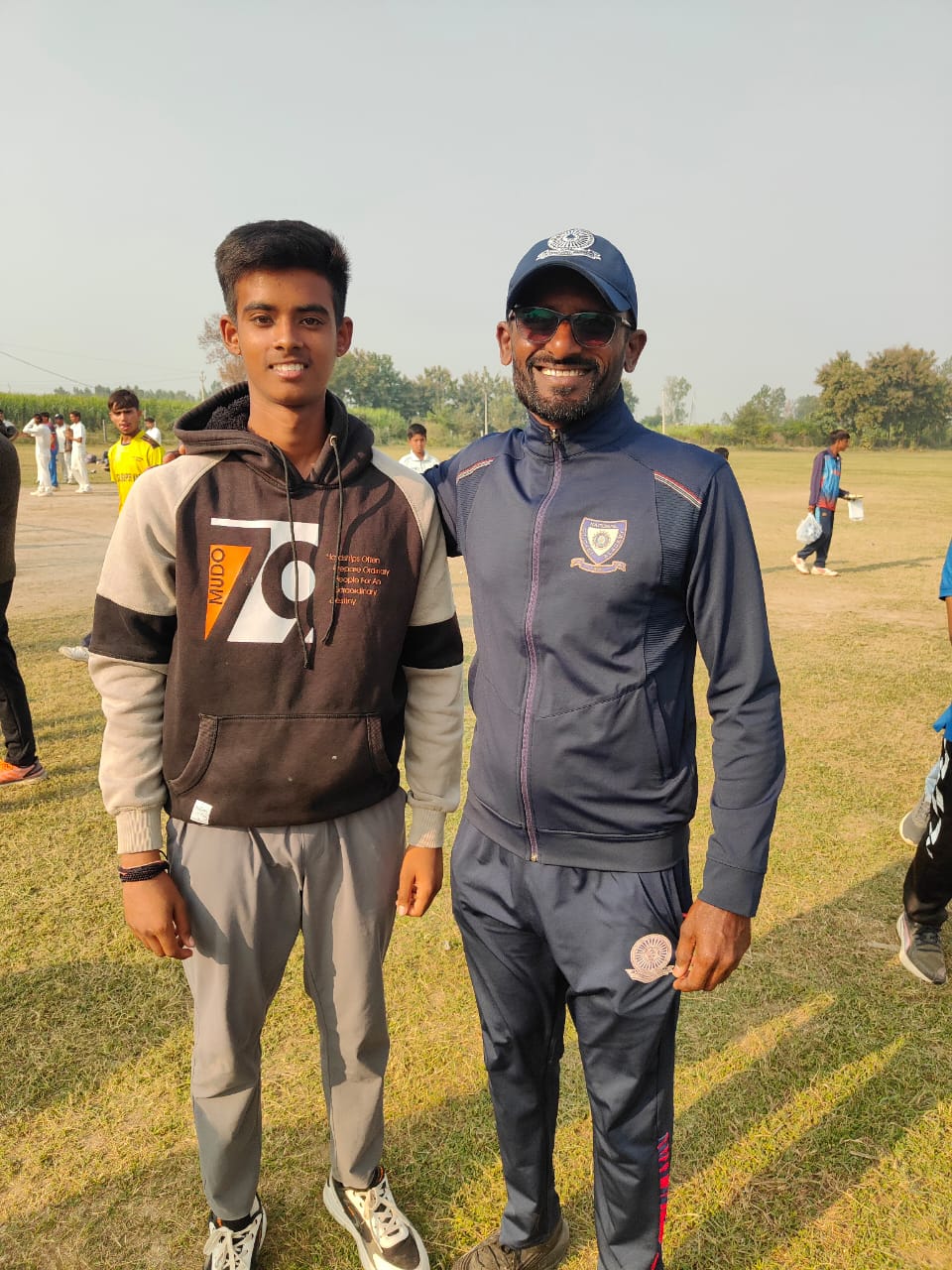 Young cricketer meeting an experienced coach on the training ground